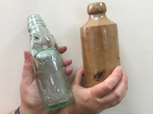 lemonade bottles and a stone jar