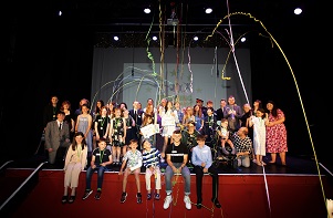 Tendring Youth Awards finalists on the stage with streamers overhead